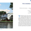 A serene Shores & Islands Ohio getaway by Schiffer Publishing, Ltd.—boats docked along the shore, green trees behind, and white waterfront buildings with red roofs beneath a lightly clouded sky.