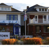 Two houses side by side: Hitsville U.S.A. and Motown Museum with blue trim, next to a red-brick house with a white porch—featured in "Detroit" by Schiffer Publishing, Ltd., an iconic Motor City souvenir or photo book.