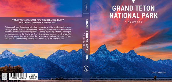 The "Grand Teton National Park" book by Schiffer Publishing, Ltd. features a vibrant cover with snow-capped peaks and a blue sky with pink clouds, making it an ideal photography book or souvenir.