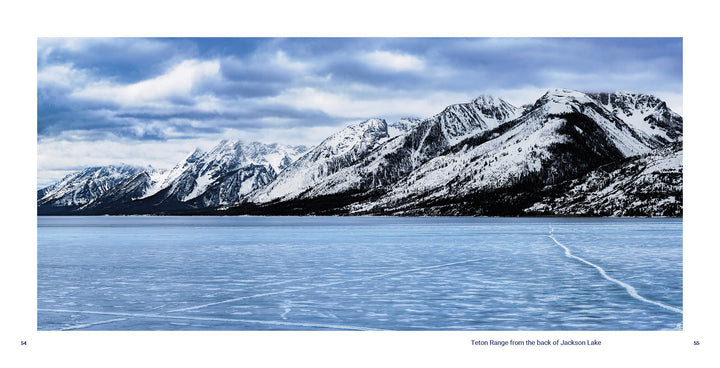 A frozen, blue Jackson Lake with a visible ice crack lies beneath the snow-capped Teton Range under cloudy skies in Grand Teton National Park. © Schiffer Publishing, Ltd.