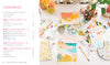 A vibrant art setup displays watercolors, brushes, a sketchbook with modern designs, and a palette. On the left is the table of contents for Schiffer Publishing, Ltd.'s "Good Vibes Art Club Learn to Draw" beginner art book in pink and black text.
