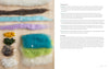 Batting fibers in various colors and preparations are neatly arranged on wood for crafting, as featured in "Needle Felting Through the Seasons" by Schiffer Publishing, Ltd., with step-by-step instructions shown on the right.