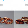 A book spread from "Turning Segmented Wooden Bangles on the Wood Lathe" by Schiffer Publishing, Ltd. shows four symmetrically patterned wooden bangles on the left, and four with square and rectangular inlays on the right.