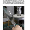 A person holds a serrated knife blade to a polishing wheel for stropping. Two white arrows show its position and movement. "Knife Sharpening Made Easy" by Schiffer Publishing, Ltd. provides a guide for honing serrated knives.